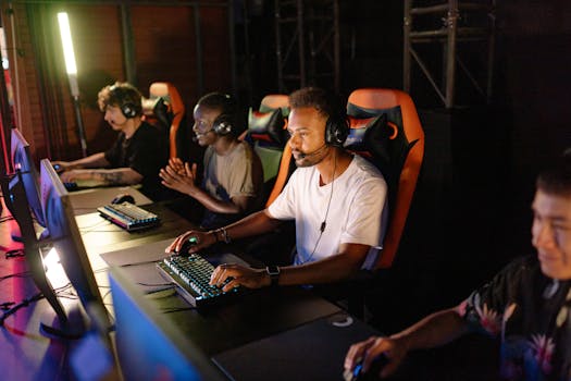 A group of young adults intensely focused on a competitive esports tournament indoors.