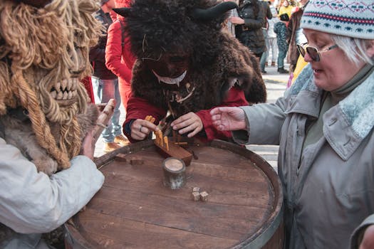 Participants in masks playing a traditional game at a winter festival in Moscow, Russia.